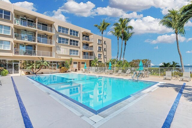 pool featuring a patio area and fence