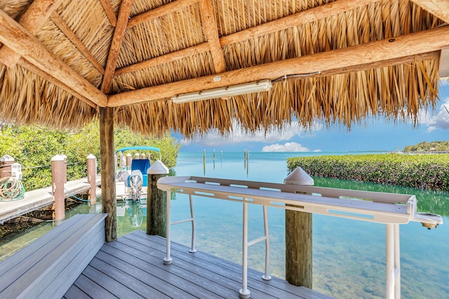 view of dock featuring a water view and a gazebo