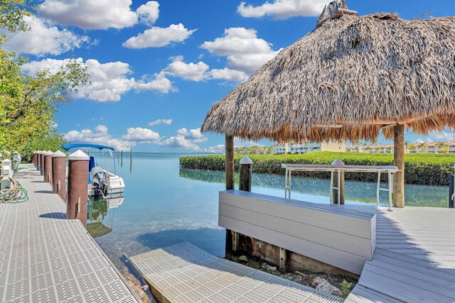 dock area featuring a gazebo and a water view