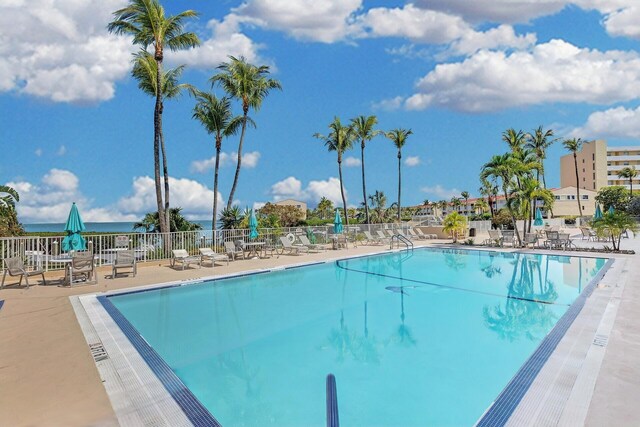 pool featuring a patio and fence