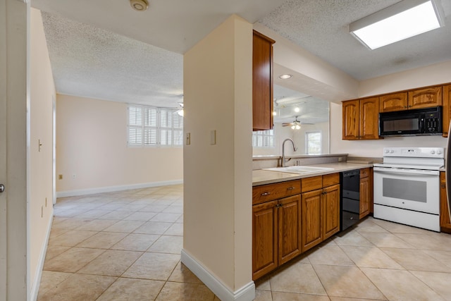 3930 S Roosevelt Blvd Unit N302, Key West, FL 33040 - kitchen featuring black appliances, a sink, brown cabinetry, a textured ceiling, and light tile patterned floors