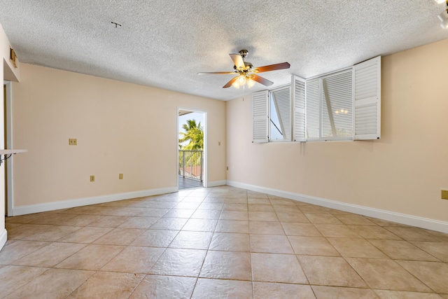 3930 S Roosevelt Blvd Unit N302, Key West, FL 33040 - unfurnished room featuring ceiling fan, a textured ceiling, light tile patterned flooring, and baseboards
