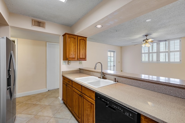 3930 S Roosevelt Blvd Unit N302, Key West, FL 33040 - kitchen featuring stainless steel fridge with ice dispenser, a sink, dishwasher, brown cabinetry, and a textured ceiling