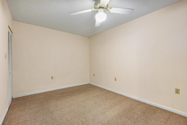 3930 S Roosevelt Blvd Unit N302, Key West, FL 33040 - spare room with carpet floors, a ceiling fan, baseboards, and a textured ceiling