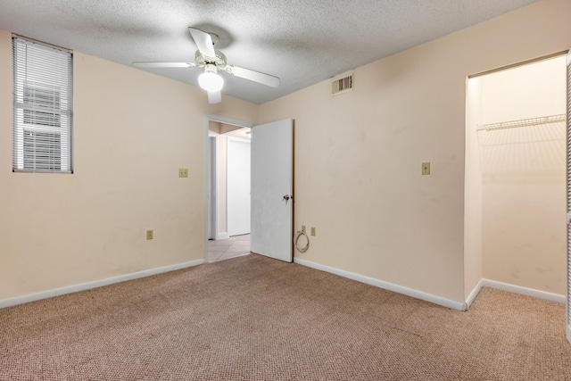 3930 S Roosevelt Blvd Unit N302, Key West, FL 33040 - unfurnished bedroom featuring light colored carpet, baseboards, a textured ceiling, and a ceiling fan
