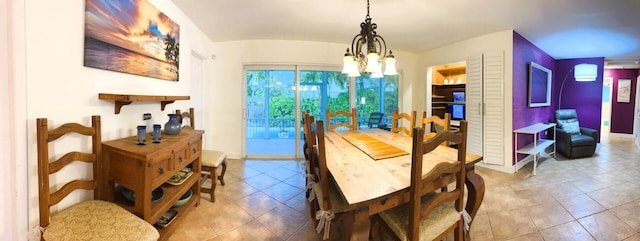 tiled dining room featuring a notable chandelier