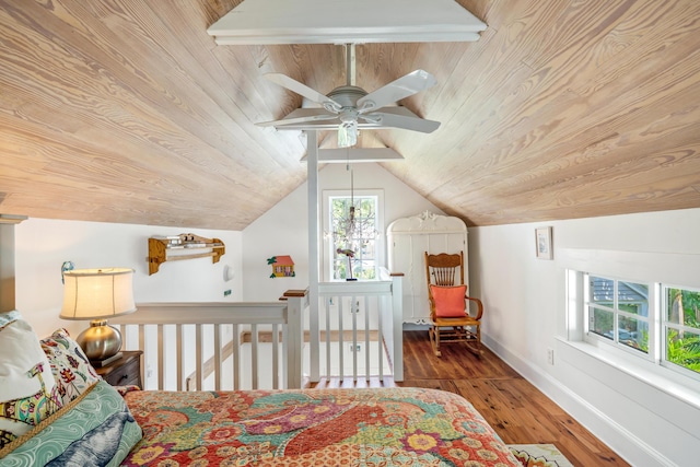 bedroom featuring lofted ceiling, hardwood / wood-style floors, wood ceiling, and ceiling fan