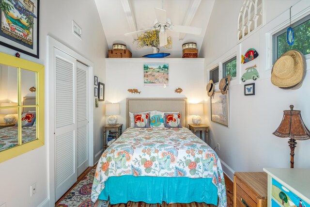 bedroom featuring vaulted ceiling and a closet