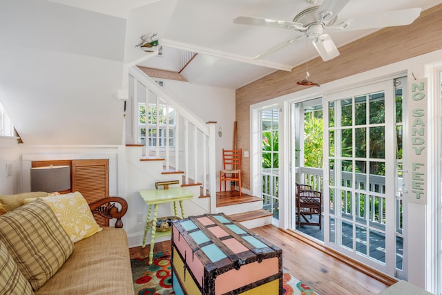 living room with hardwood / wood-style flooring and ceiling fan