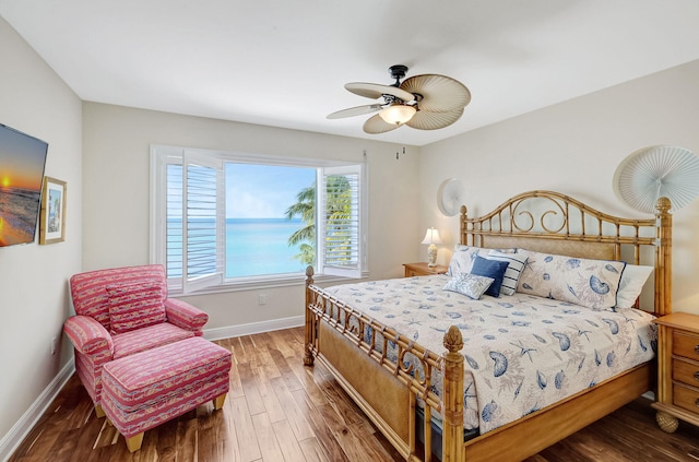 bedroom with hardwood / wood-style floors and ceiling fan