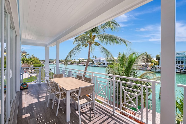 wooden deck with a water view