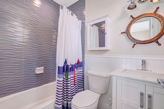 full bathroom with vanity, shower / tub combo with curtain, and toilet