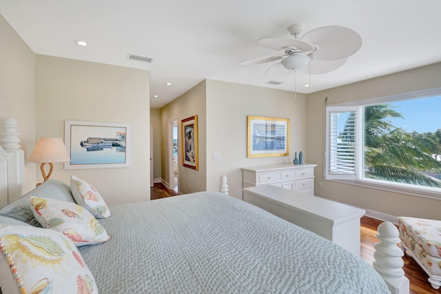 bedroom with hardwood / wood-style flooring and ceiling fan