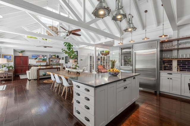 sunroom / solarium featuring beam ceiling