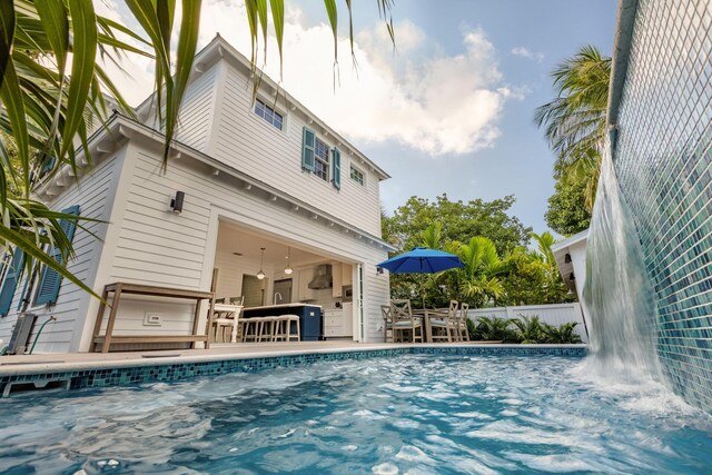 view of pool featuring fence
