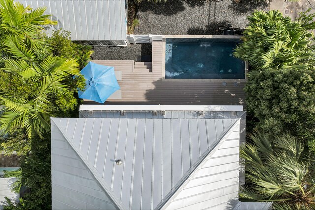view of subject property featuring a pool area