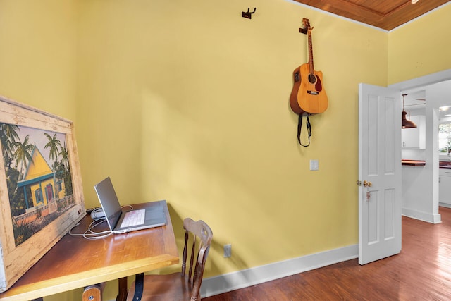 home office featuring wooden ceiling, baseboards, and wood finished floors