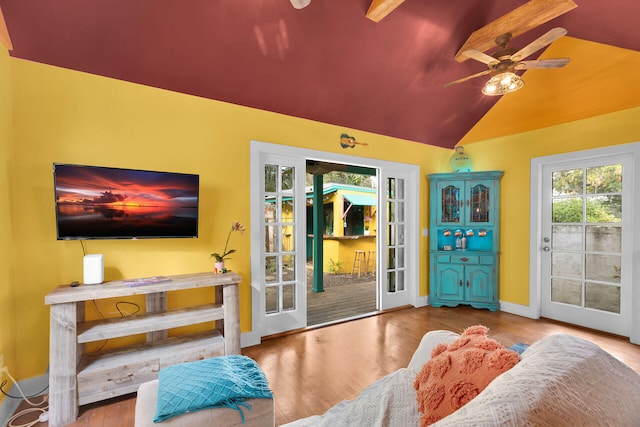 interior space with lofted ceiling and ceiling fan