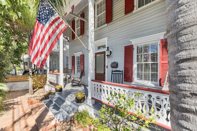 property entrance with covered porch