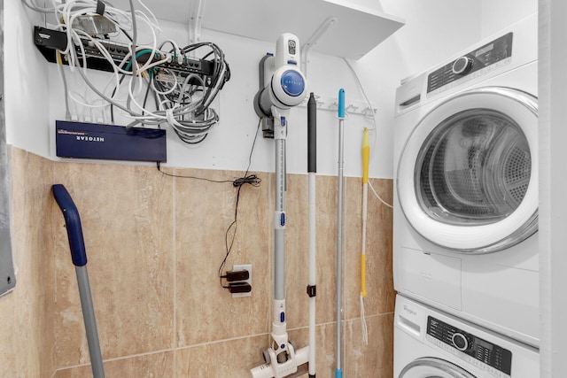 laundry area featuring stacked washer and clothes dryer