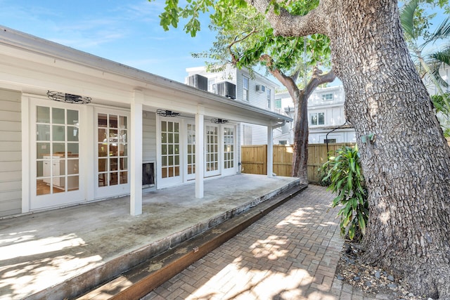 wooden terrace featuring a patio area and french doors