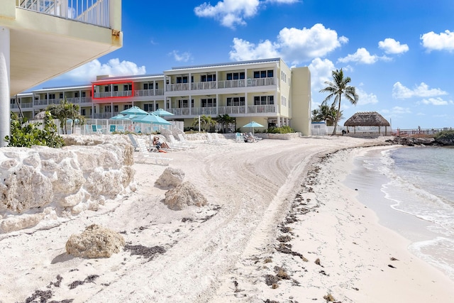 view of building exterior featuring a view of the beach