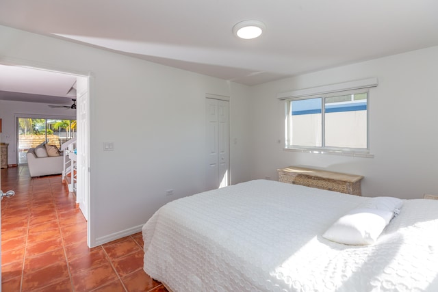 tiled bedroom featuring a closet