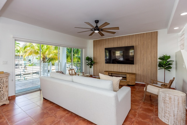 tiled living room with ceiling fan