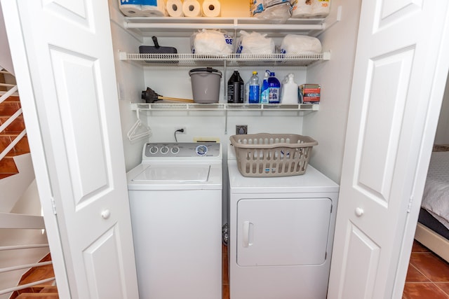 washroom with tile patterned floors and washer and dryer