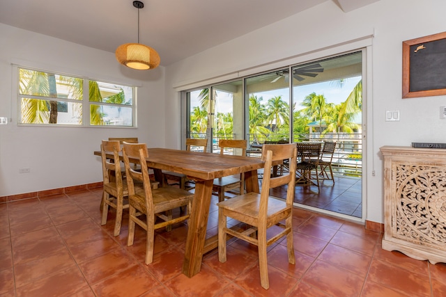 tiled dining space with ceiling fan