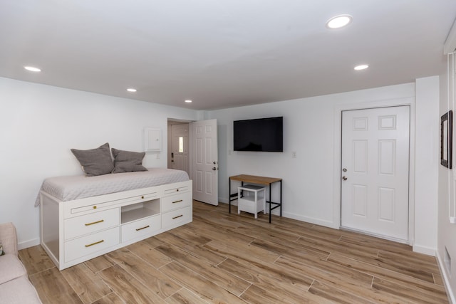 bedroom with light hardwood / wood-style floors