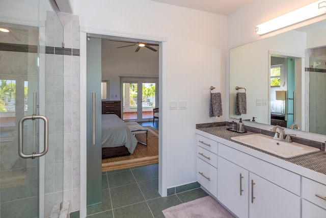 bathroom featuring vanity, a shower with door, tile patterned floors, and french doors