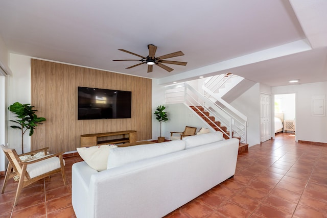 tiled living room with ceiling fan