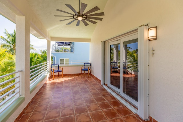 view of patio with a balcony and ceiling fan