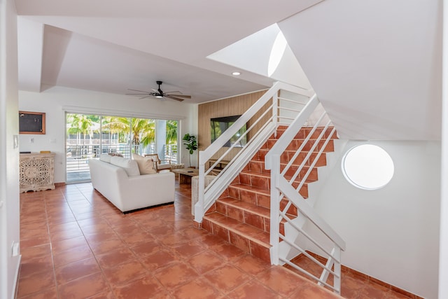 stairs with ceiling fan