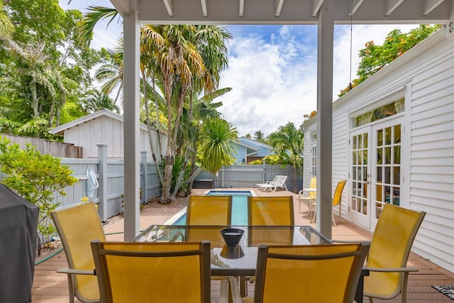 view of patio / terrace featuring french doors and a swimming pool side deck