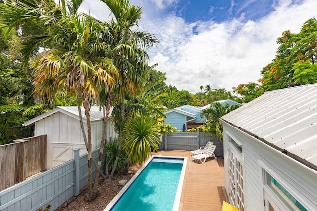 view of swimming pool with a shed