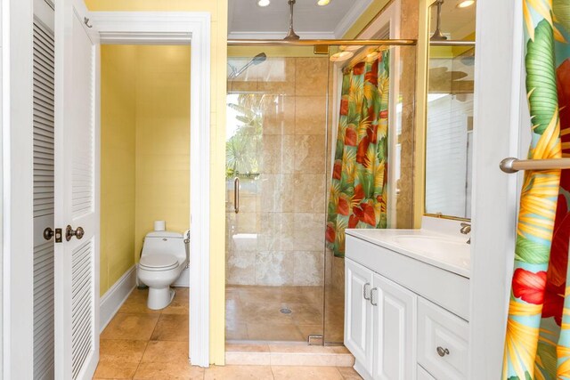 bathroom with tile patterned flooring, vanity, ornamental molding, toilet, and walk in shower