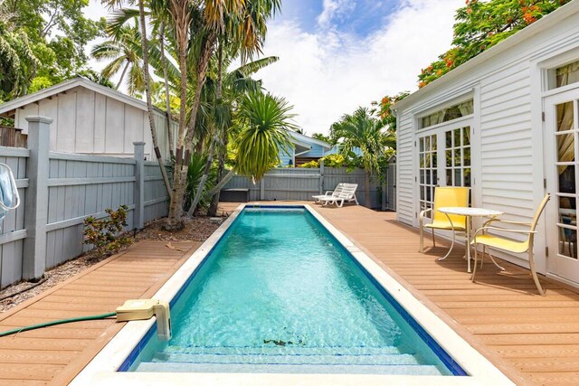 view of swimming pool with a deck