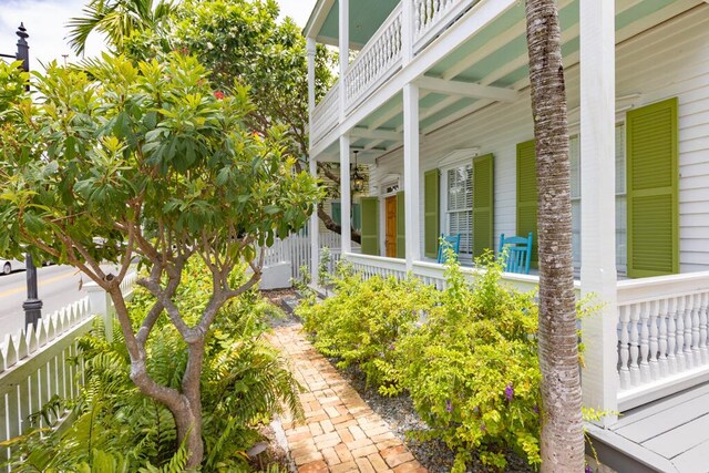 view of side of home with a balcony