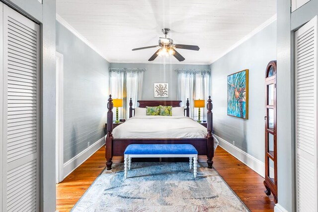 bedroom featuring crown molding, hardwood / wood-style flooring, and ceiling fan