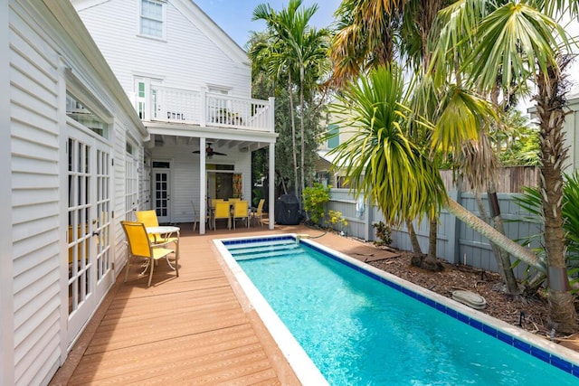 view of pool featuring ceiling fan