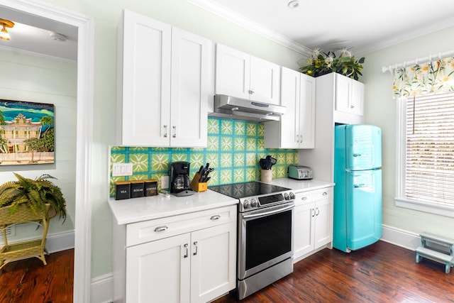 kitchen with white cabinets, ornamental molding, fridge, and stainless steel range with electric cooktop