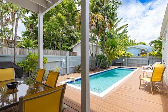 view of pool with a wooden deck