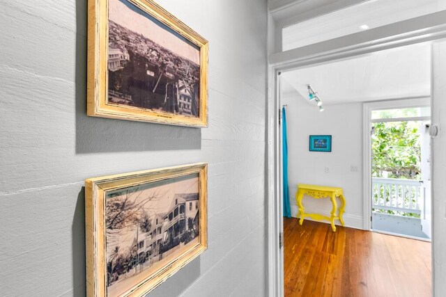 hall with hardwood / wood-style floors