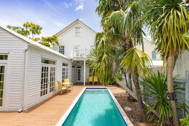 view of swimming pool featuring a deck