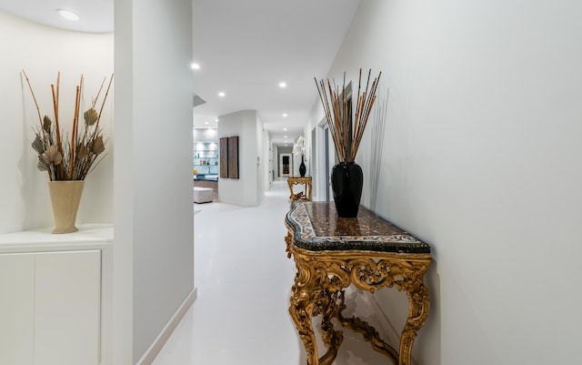 corridor with concrete flooring