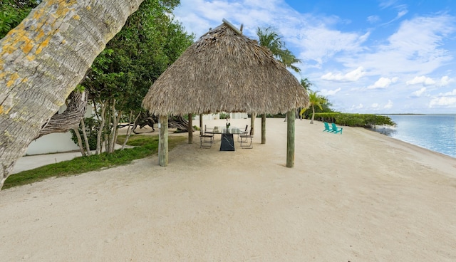 surrounding community featuring a gazebo and a water view