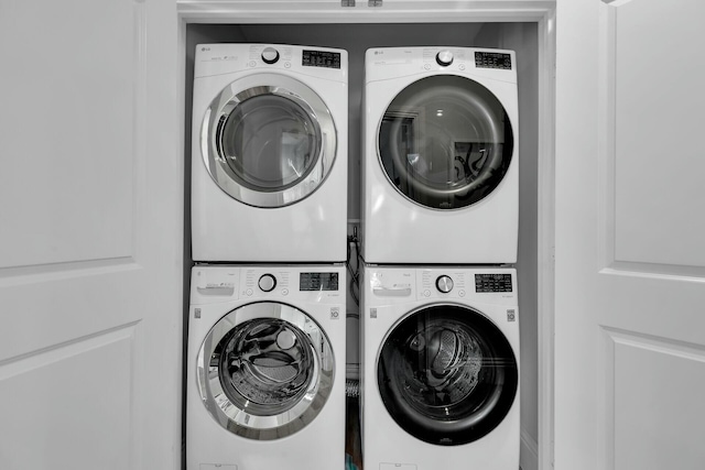 laundry area with laundry area and stacked washer and clothes dryer