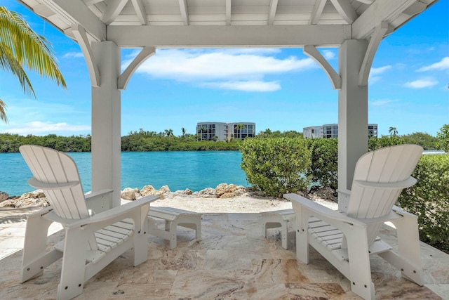 view of patio / terrace with a water view